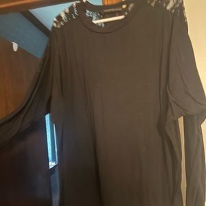 Sheer black Piko style top with lace detail on back of shoulders